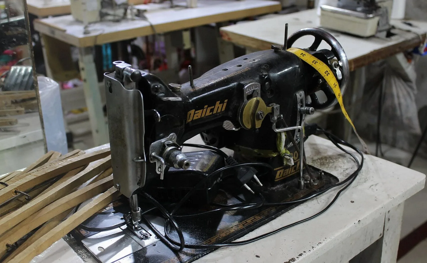 Vintage industrial sewing machine at a workshop table
