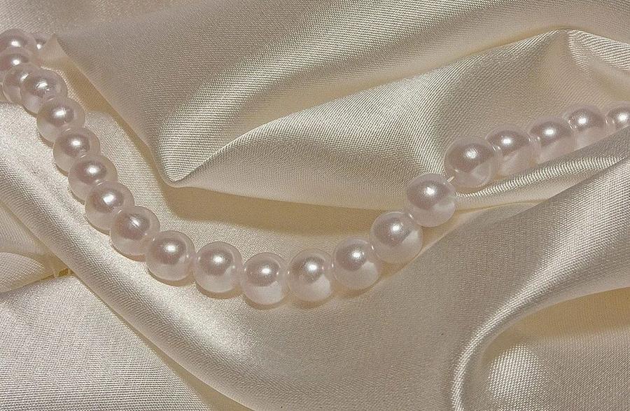 Cream silk satin with a strand of pearls